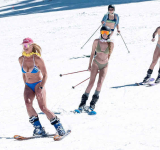 In record heat, American ski resorts  bulldoze snow, skiers wear bikinis